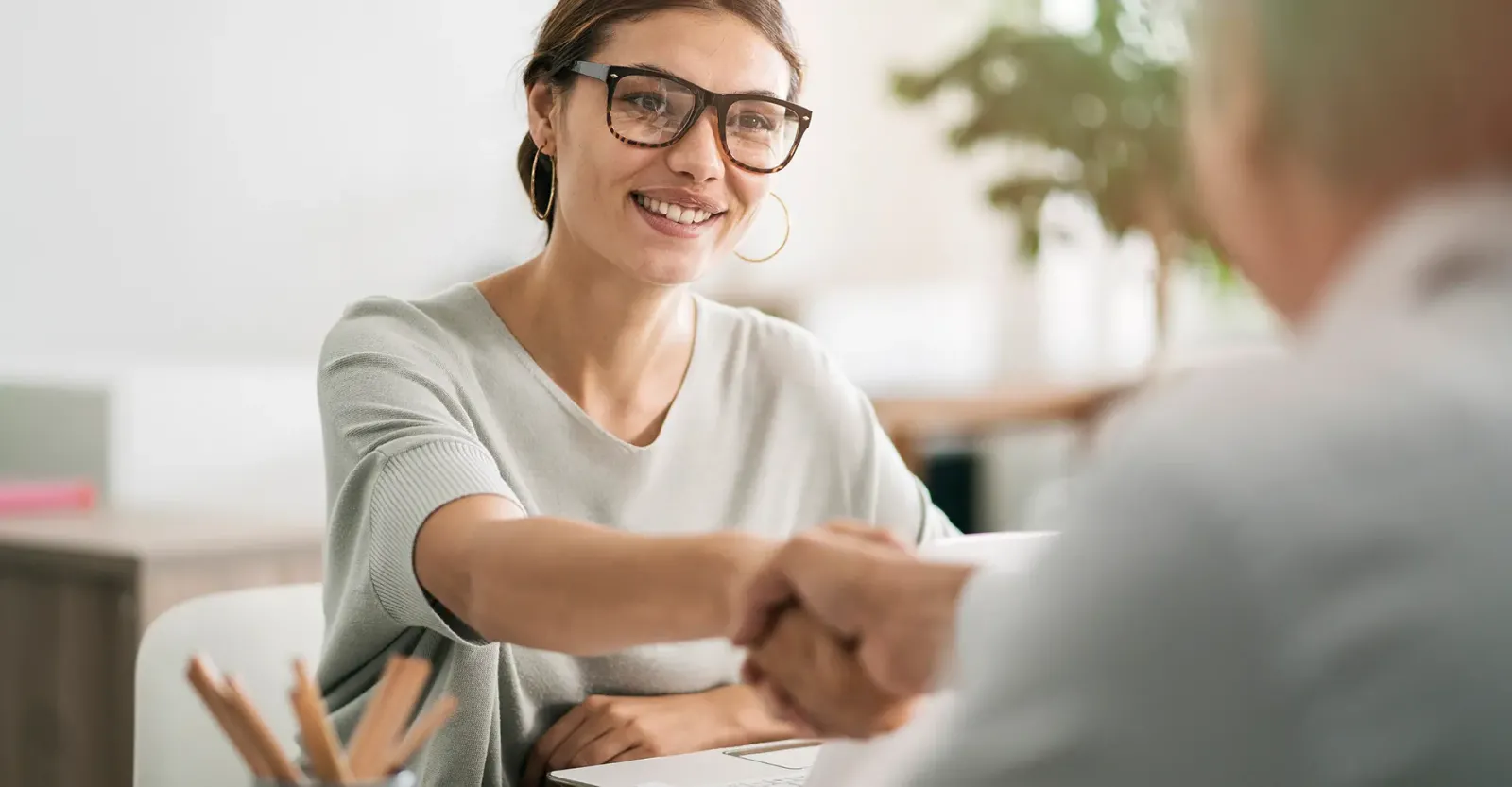 woman shaking mans hand
