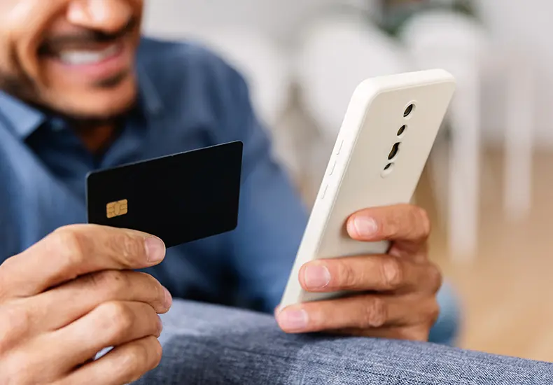 woman holding credit card